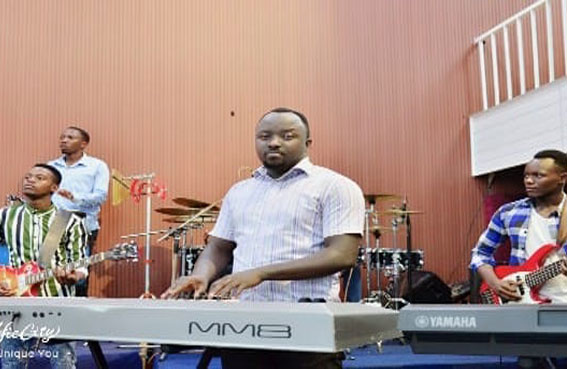 Livingstone performing with Asaphe Music International at ZION TEMPLE - GATENGA